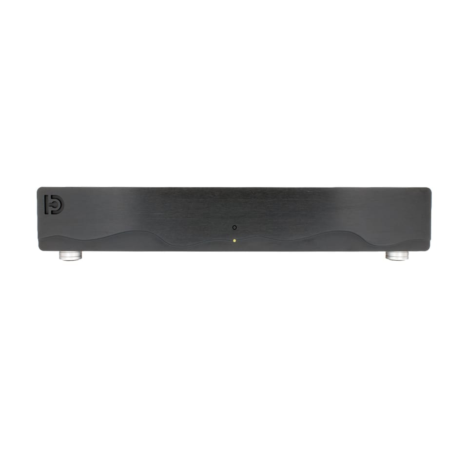 The front of a finished Nilai500 stereo kit: a wide, low black aluminium chassis with the same wave-profile fascia and amber standby indicator, on chrome feet.